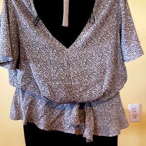 Dressy white shirt with a black spotted design. Sienna Sky. Size S in woman’s